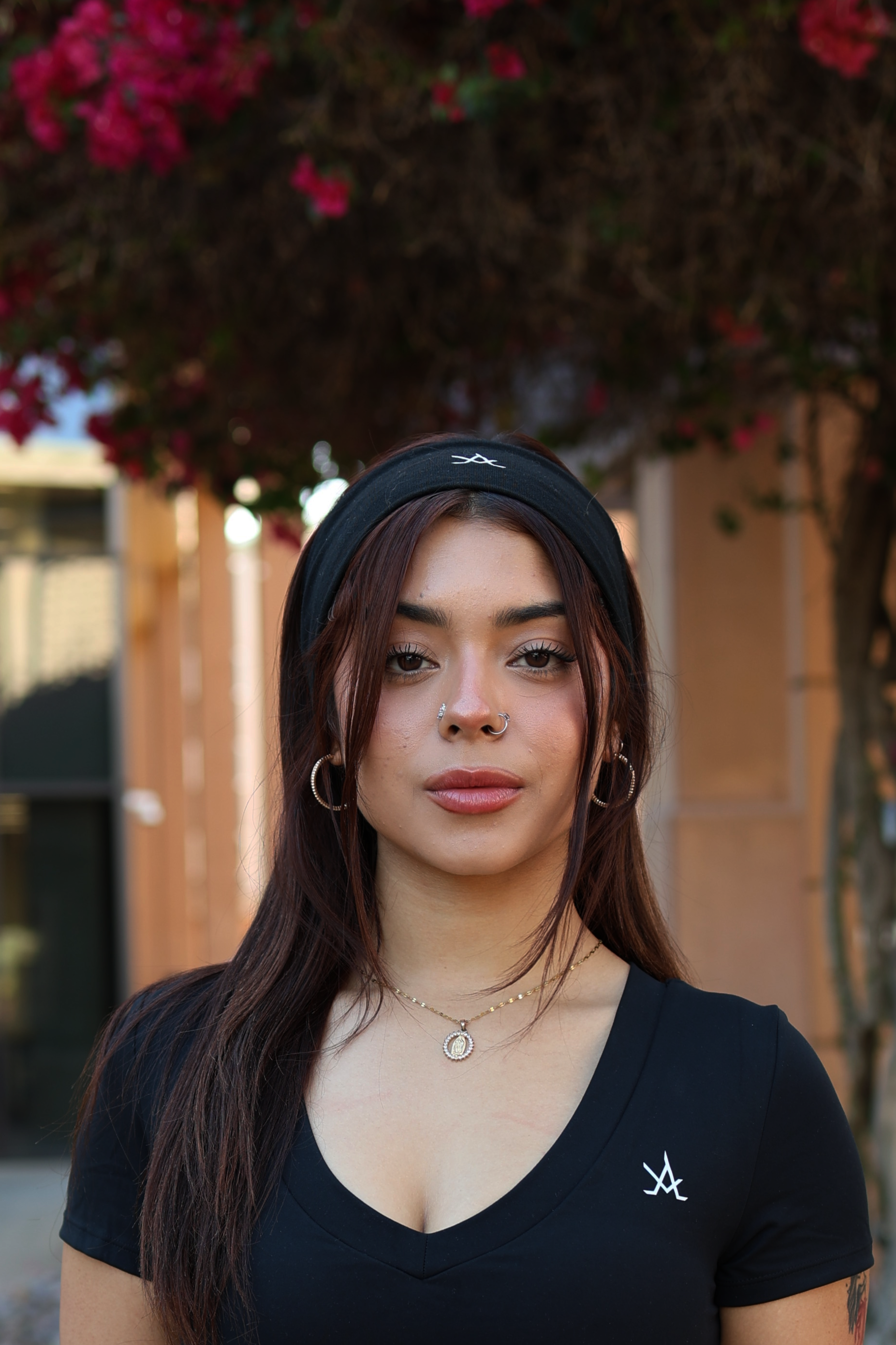 Women’s Training Headband moisture-wicking non-slip black athletic headband modeled outdoors