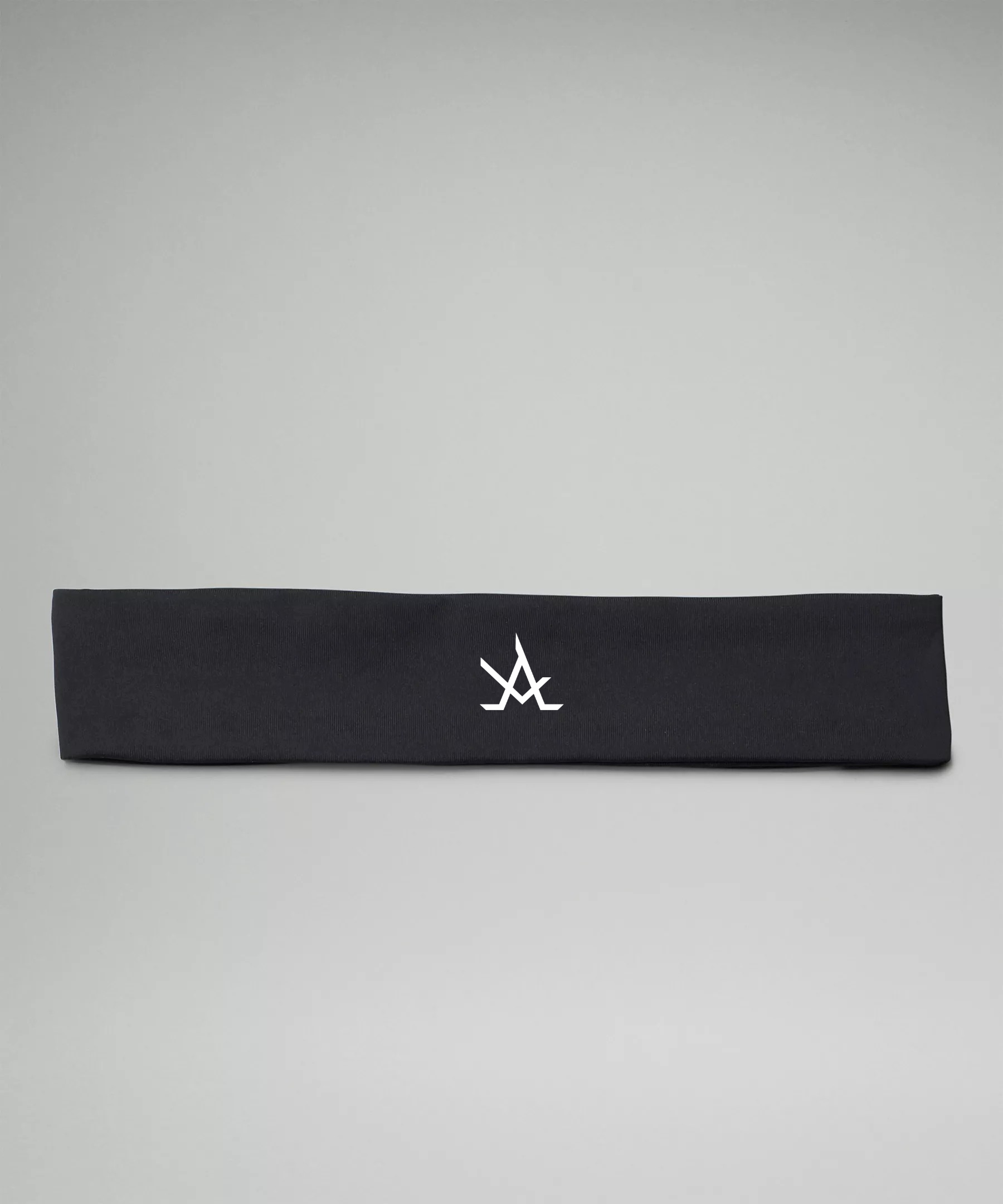 Black women's training headband with moisture-wicking, non-slip fabric and logo detail