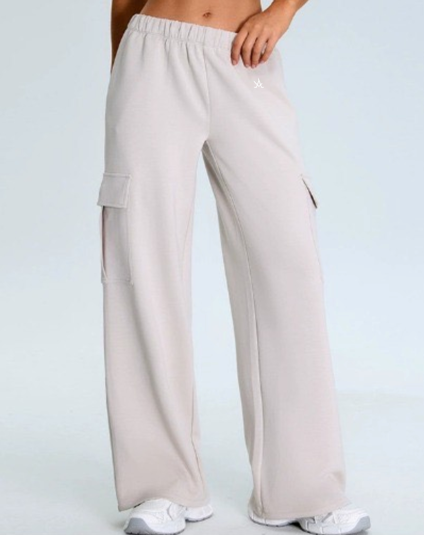 Premium Active Sweat Pants for women, high-waisted, light gray joggers with cargo pockets, soft fabric, ideal for workout and athleisure.