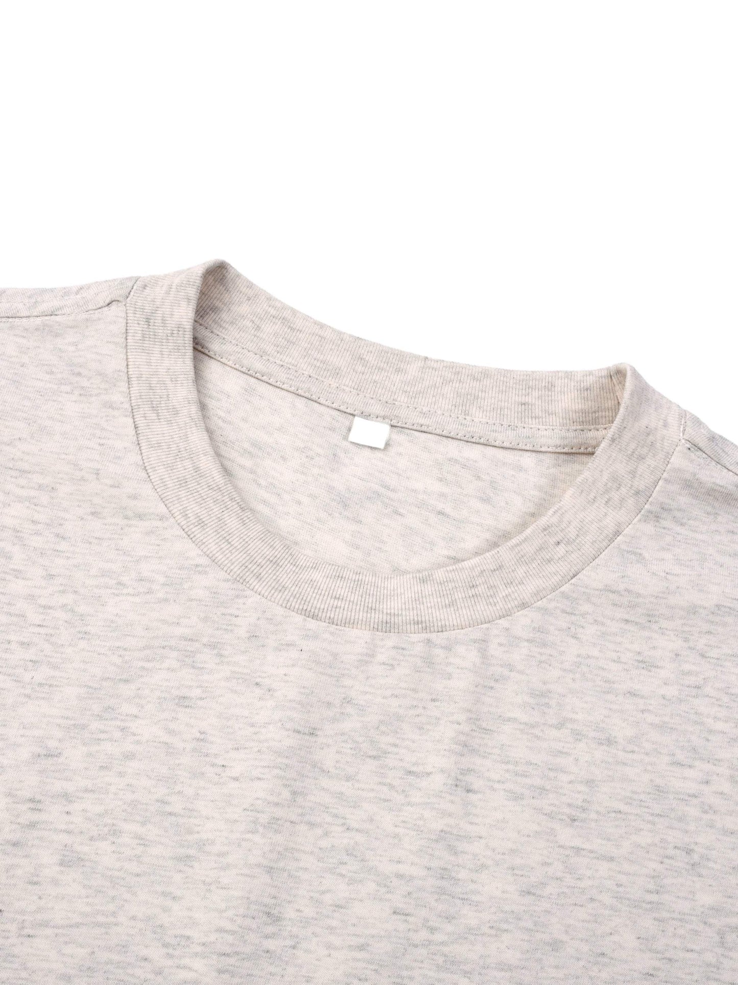 Close-up of a light gray Essential T-Shirt with round neck and drop shoulder, made of 100% cotton fabric.
