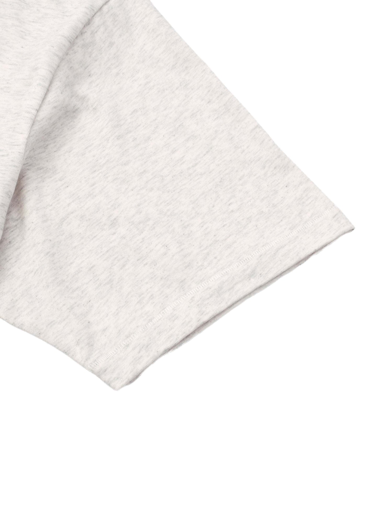 Close-up of a light grey Essential T-Shirt sleeve made from 100% cotton with loose fit and moderate thickness